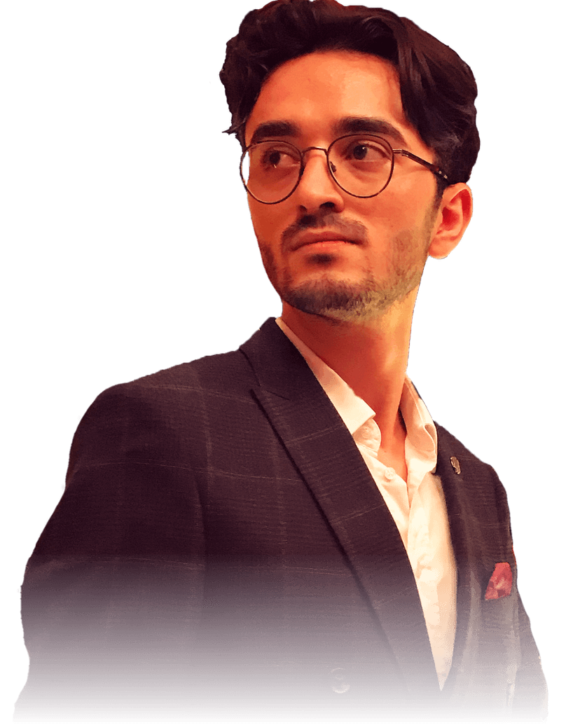 Hüseyin Kaya, wearing round glasses and a dark double-breasted suit